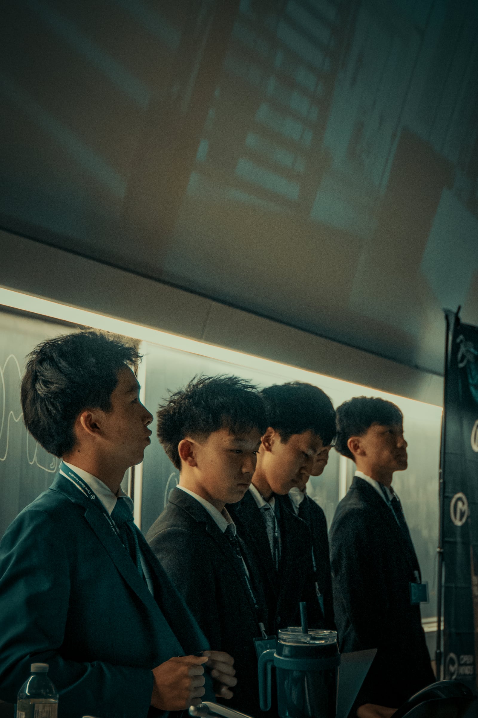 A team lined up at the front of the room before presenting