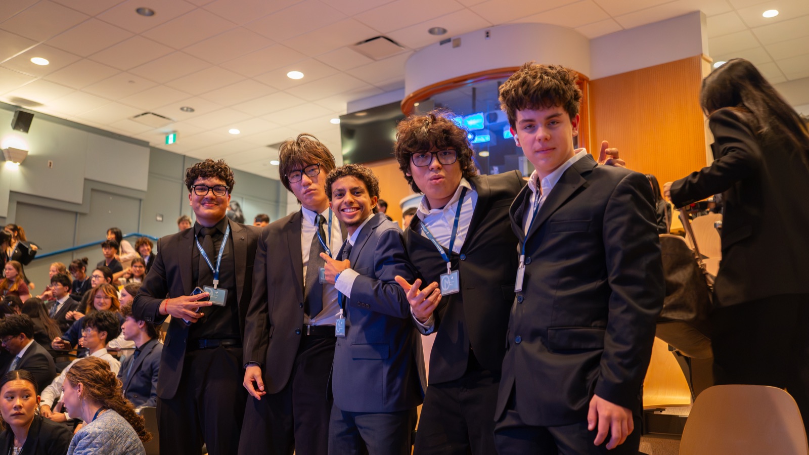 A group of students together in the lecture hall